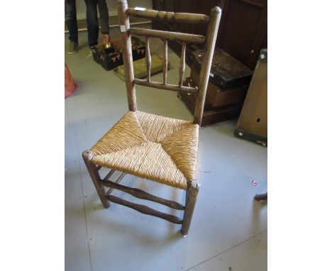 Harlequin set of seven early 19th Century ash and elm side chairs with rail and stick backs above rush seats, turned supports