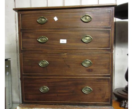 George III mahogany commode converted to two hinged doors, simulated as four drawers with oval brass handles 
