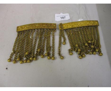 Two gilt metal epaulettes, stamped Spencer, London 