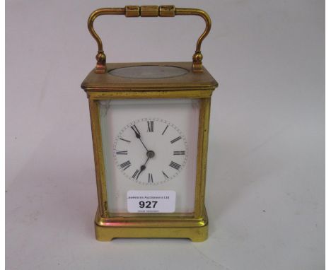 Early 20th Century gilt brass cased carriage clock, the enamel dial with Roman numerals, the two train movement striking on a
