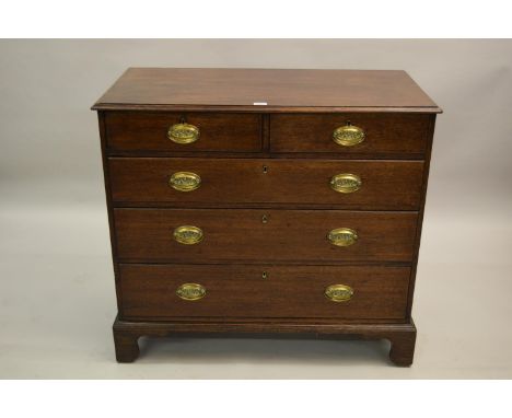 George III oak chest of two short and three long drawers with oval brass handles and bracket feet, 40.5ins wide 