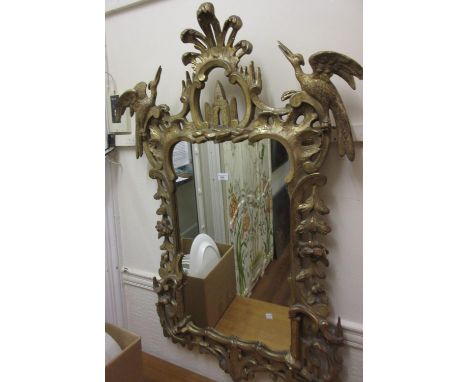 Good quality reproduction gilded composition wall mirror in Chippendale style, the pierced floral frame with Hoho bird and sc
