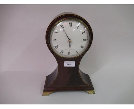Reproduction mahogany and line inlaid balloon shaped mantel clock, the enamel dial with Roman numerals inscribed ' Comitti of