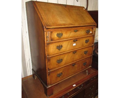 Mid 20th Century figured walnut bureau in Queen Anne style, the fall front enclosing a fitted interior above four graduated d