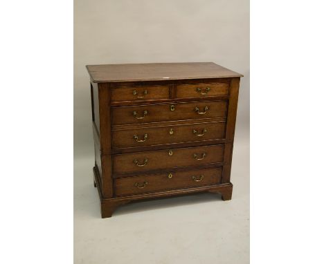 18th Century oak two part chest, the moulded top with rounded corners above four drawers, the second drawer of double depth s