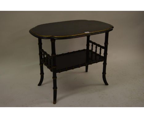 Unusual early 20th Century ebonised and gilt shaped top table with undertier having faux bamboo carving with swept legs beari