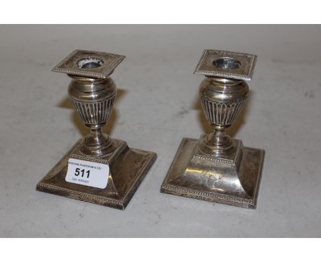 Pair of early 20th Century Sheffield silver dwarf candlesticks in Adam style, 4.25ins high 