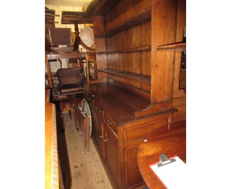 Good quality reproduction oak dresser, the boarded shelf back above four drawers and four rectangular fielded panelled doors 