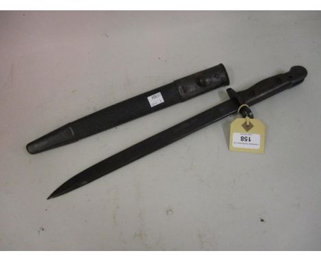 World War II bayonet with wooden grip and steel mounted leather scabbard 