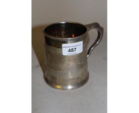 20th Century Sheffield silver mug of tapering form, 7 troy ouncesQuite heavily scratched from use and both the top rim and th