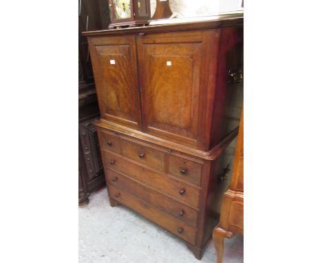 Early 19th Century teak, camphor wood and black line inlaid military campaign side cabinet, the moulded cornice above a pair 