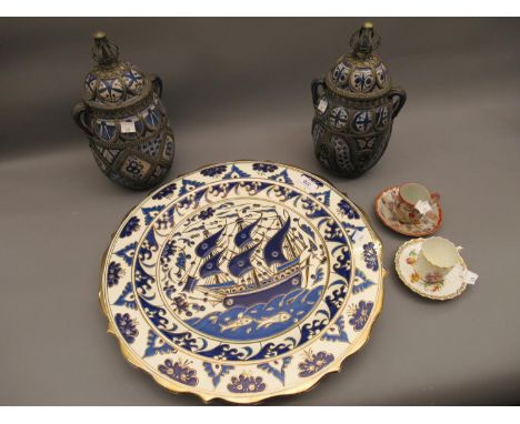 Pair of Middle Eastern pottery and white metal mounted two handled jars with covers, 12ins approximately, a modern Greek pott
