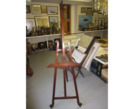 Good quality late 19th / early 20th Century walnut and parcel gilt display easel, the pierced carved surmount above a lyre sh