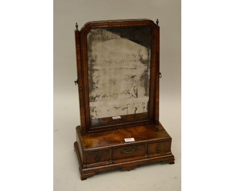 Queen Anne walnut swing frame toilet mirror with a caddy moulded three drawer box base, 23ins x 15ins 