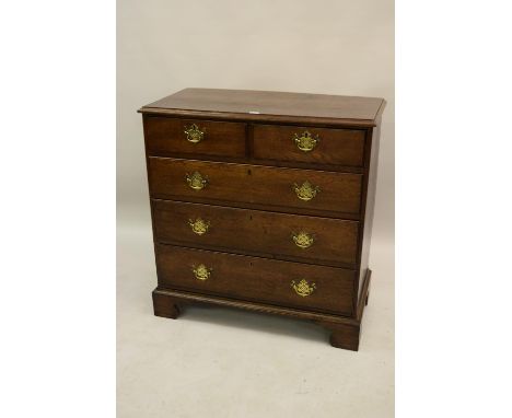 18th Century oak chest, the moulded top above two short and three long drawers with brass handles, on bracket feet, 39ins wid