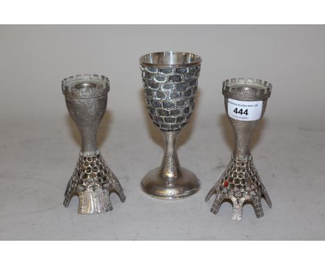 Pair of sterling silver candlesticks of castellated and pierced design, 5.5ins high, 10 troy ounces, inscribed R. Matar, 1981
