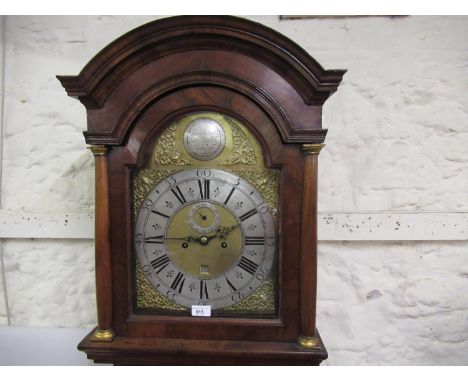 Figured walnut longcase clock, the broken arch hood with flanking pilasters above a moulded panel door and conforming plinth 