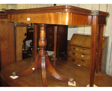 Reproduction mahogany rectangular fold-over card table, the moulded baize lined fold-over top above a turned column support a