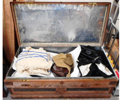 Large travel trunk marked to Capt. T.W. Hamilton. H.L.I. Condition107cm x 53cm x 38cm Iron fitting rust. Some wooden worm