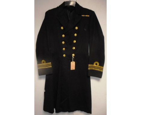 British Navy dress uniform greatcoat with Gieves Ltd interior pocket label "14921 Lt Cr J K B Stephenson R 014/3/32" having b