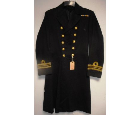 British Navy dress uniform greatcoat with Gieves Ltd interior pocket label "14921 Lt Cr J K B Stephenson R 014/3/32" having b