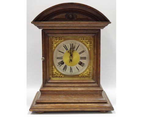 A late 19th century oak mantel clock, Roman numerals, twin winding holes, eight day movement, striking on a gong, c.1890 