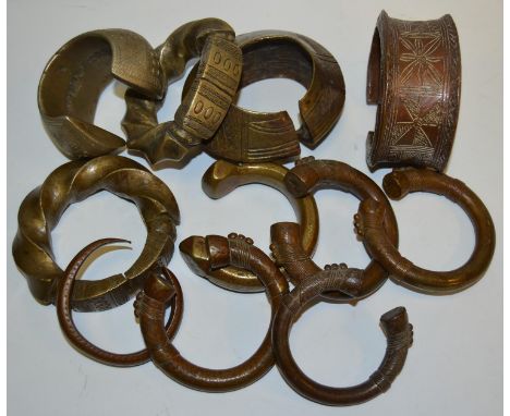 Tribal Jewellery - a Benin style bronze bangle, others similar decorated with assorted geometric motifs, mixed shapes and siz