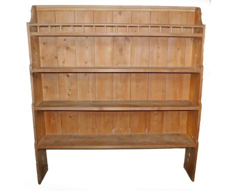 A pine dresser top, of four shelf, waterfall form, the uppermost shelf with a galleried front, 167cm high, 150cm wide, 30cm d