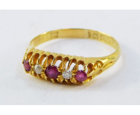 An 18ct gold ruby and diamond ring, the gypsy setting set with three rubies and two diamonds, in claw setting, 2.3g all in.  