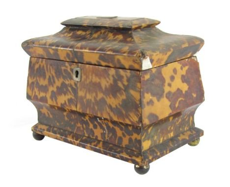 A Regency blonde tortoiseshell tea caddy, of pagoda form, with silver key escutcheon and plaque to lid, opening to reveal a t