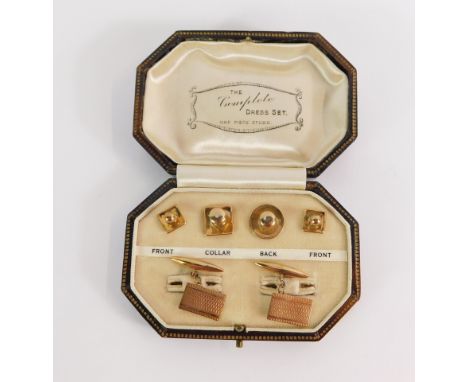 A 9ct gold cased gentleman's set, comprising a pair of rectangular engine turned cuff links, and four collar studs, in fitted