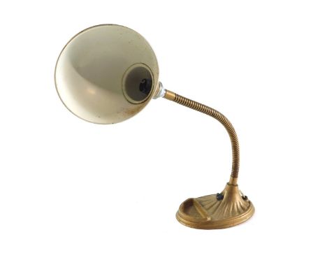 A continental early 20thC metal desk lamp, the domed shade on an angular stem, and a fluted base, approximately 55cm high. 