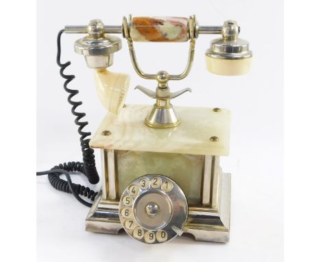 An onyx vintage telephone, with chrome overall finish and dial, 30cm high. 