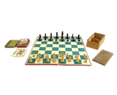 A group of games, comprising a Staunton type wooden chess set, boxed, with chess and draught board, and a box of playing card