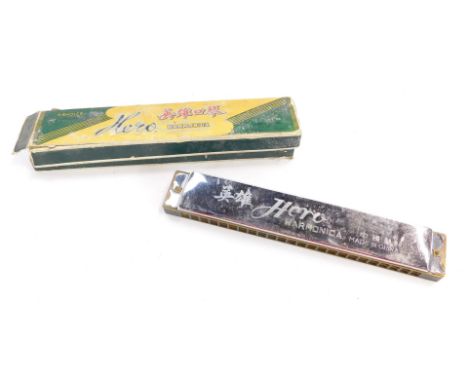 A Hero harmonica, boxed. 