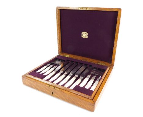 A plated fruit canteen of cutlery, with twelve piece settings, with forks and knives, mother of pearl handles on EPNS blades,