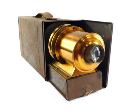 A Victorian tin plate and brass magic lantern, patent no. 2459, with a 6 inch lens, cased. 