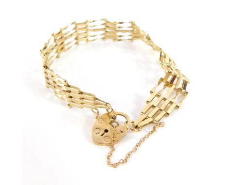 A 9ct gold gate bracelet, with five row design bar gate, on safety chain and padlock, 16cm long, 4.5g all in.  