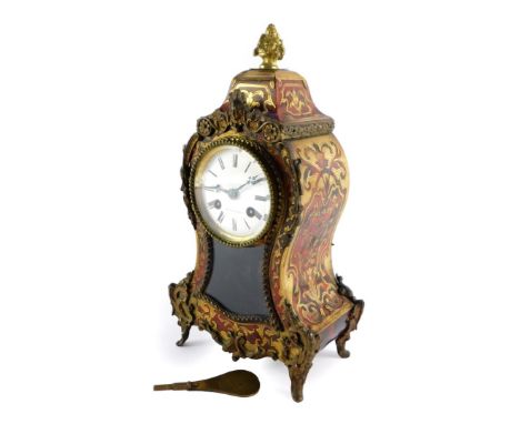 A French late 19thC Boulle mantel clock, the circular dial enamel dial signed Bright a Paris, and bearing Roman numerals, wit