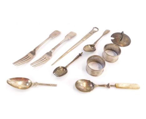 A group of silver and effects, comprising two Victorian silver table forks, a pair of George V silver engine turned napkin ri