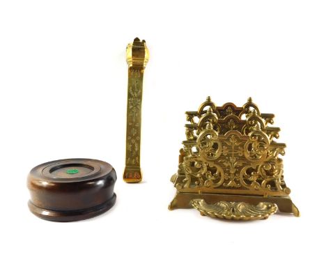A late 19thC brass two tier latter rack, a Chinese brass scribe's case with floral engraving, and an oak  gavel block. (3) 