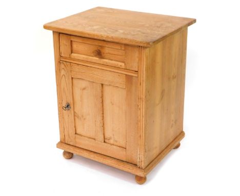 A rustic pine pot cupboard, with a single drawer above a cupboard door, opening to reveal a single shelf, raised on but feet,