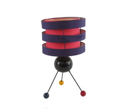 A retro design Atomic table lamp, formed from a bowl, on metal rods, with blue, red and yellow ball feet, a modern pink and p