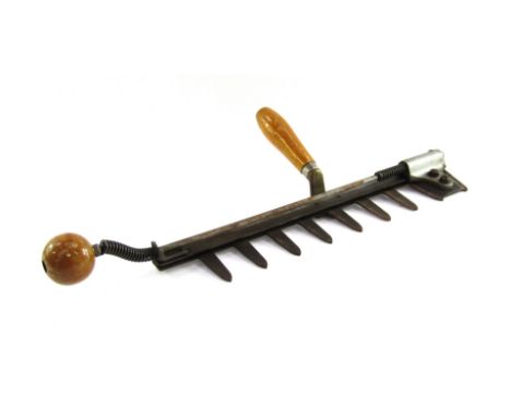 A vintage hedge trimmer, stamped Code Half Time, patent number 16418-49, 54cm long.  