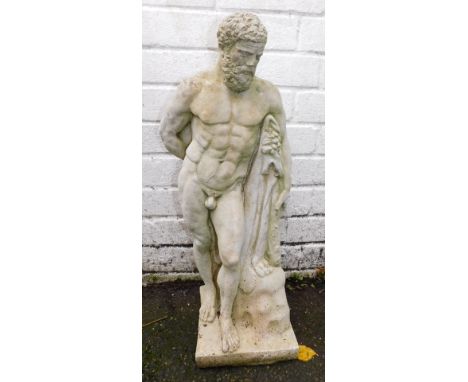 A cast concrete figure of Zeus, carrying a cloak, perched against a rock, 60cm high. 