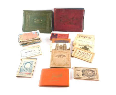 Post and cigarette cards, to include a collection of seaside postcards, The Madrid handbook, The Architecture of France black