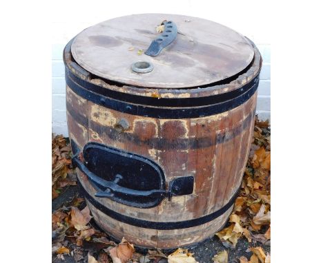 A vintage pine and iron bound butter churn,  by Morgan, Carmarthen, 84cm high, 55cm diameter. 