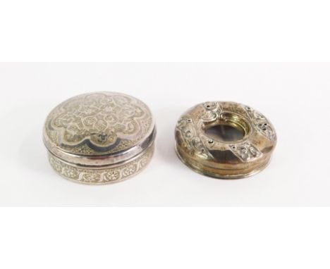 A Persian silver trinket box, the domed top with embossed floral scroll detailing, and enclosing a central ring or dressing t