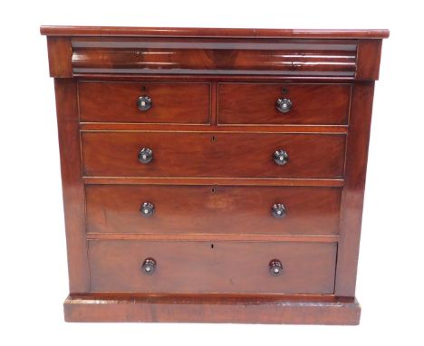 A Victorian Scottish mahogany chest, with one cushion drawer above two short and three long graduated drawers, with turned ha