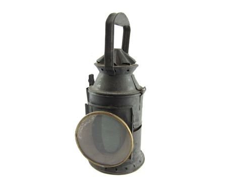 A vintage black railway lantern, the flared design top with blackened finish and pierced detail bottom, 39cm high. 